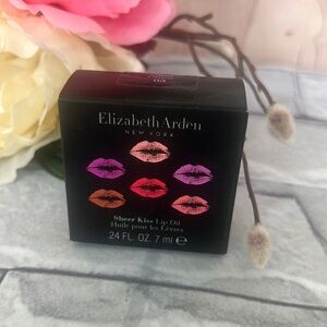 NIB Elizabeth Arden NY sheer kiss lip oil Coral caress 03